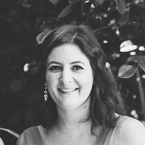 A woman smiling for the camera.