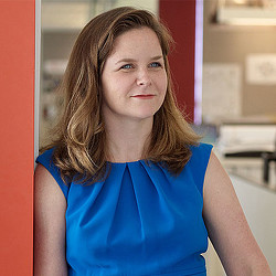A woman in a blue shirt.