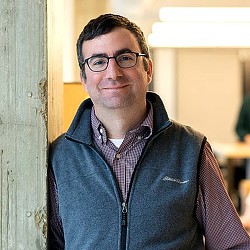 A man wearing glasses.