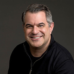 A man smiling for the camera.