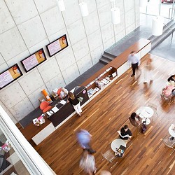 A group of people sitting at tables.