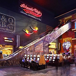 A street with signs and people sitting at tables.