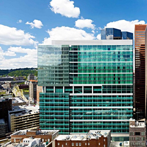 A high rise building with glass windows.
