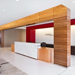 A room with a desk and a screen.