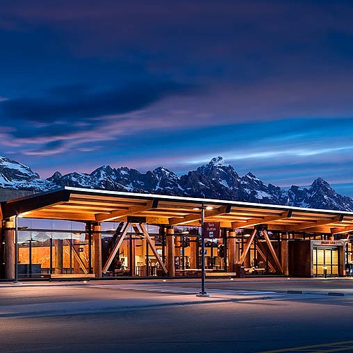A building with mountains in the background.