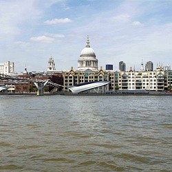 A body of water with buildings in the background.