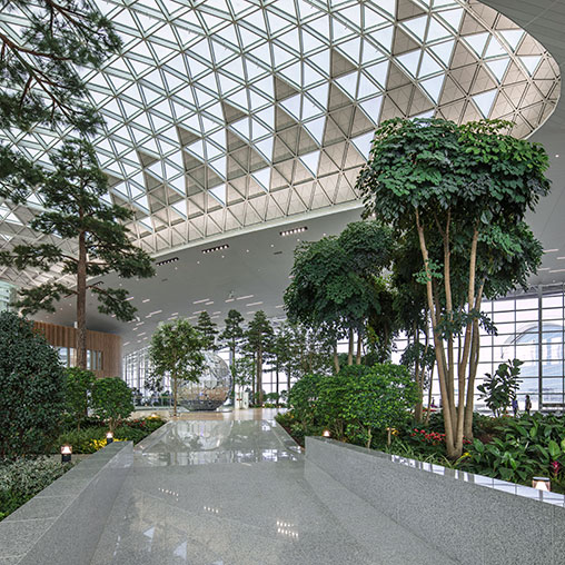 A building with trees and plants.