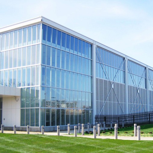 A large glass building with Pinakothek der Moderne in the background.