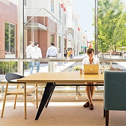 A person standing at a table.
