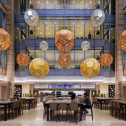 A large room with tables and chairs.