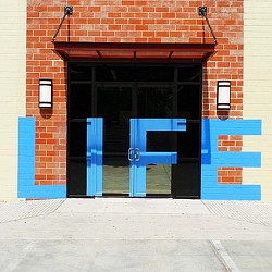 A building with blue doors.
