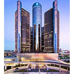 A few tall buildings with Renaissance Center in the background.