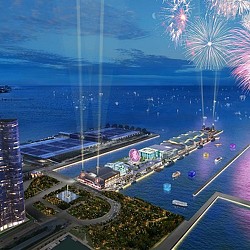 A city with a body of water in the background.