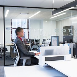 A person sitting at a desk.