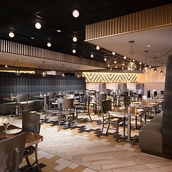 A room with tables and chairs.