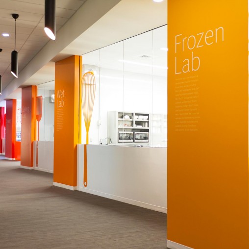 A hallway with orange doors.