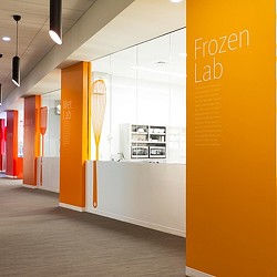 A hallway with orange doors.