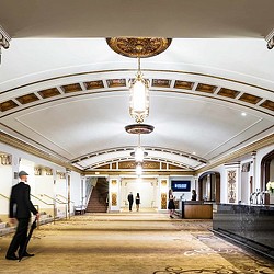 A person walking in a large building.