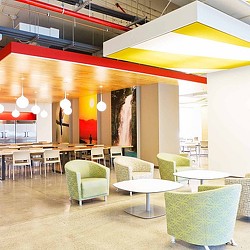 A room with tables and chairs.