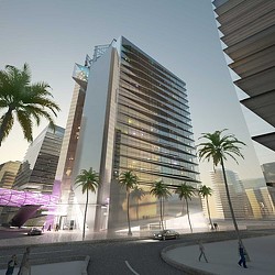 A tall building with palm trees.