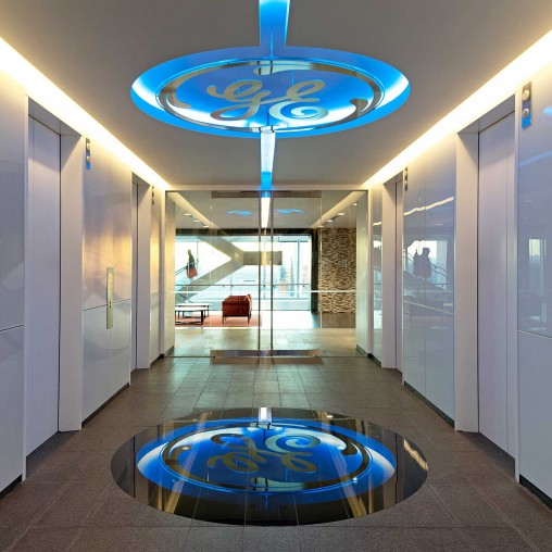 A large room with a circular floor and a circular blue circle with a blue circle in the center.