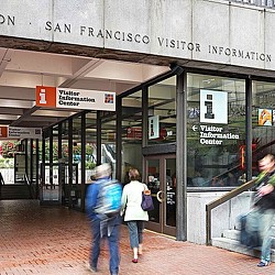 People walking in front of a store.