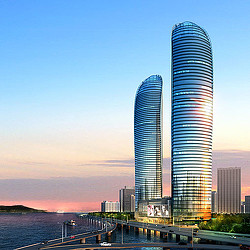 A couple of tall buildings by the water.