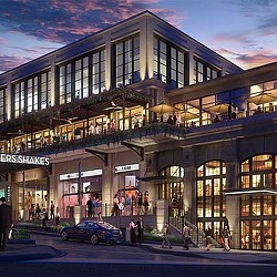 A building with a car parked in front of it.