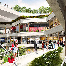 A person posing in front of a building with people walking around.