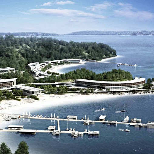 A body of water with boats and buildings by it.