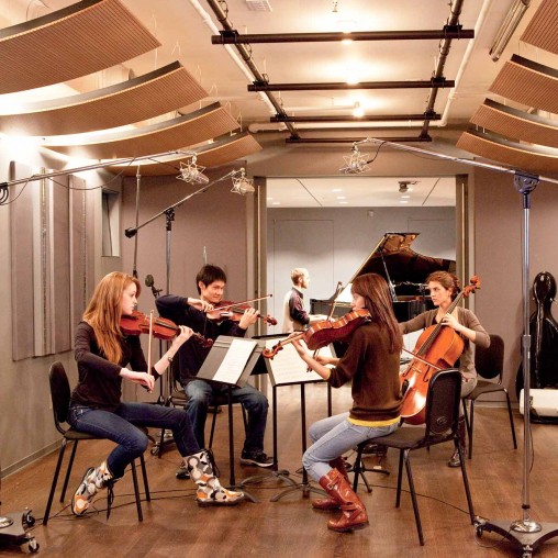 A group of people playing instruments.