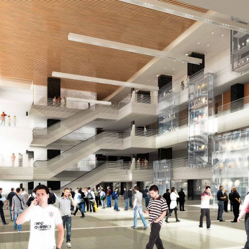A group of people walking in a large building.