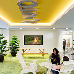 A group of people sitting at tables.