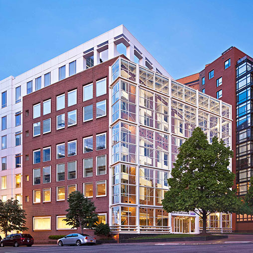 A multi-story building with many windows.
