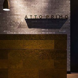 A sign on a brick wall.