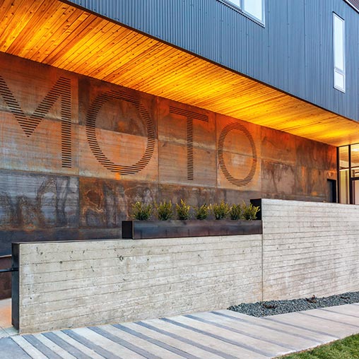 A building with a large mural on the side.