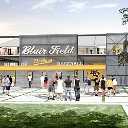 A group of people standing outside a building.