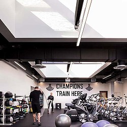 A couple of people in a garage.