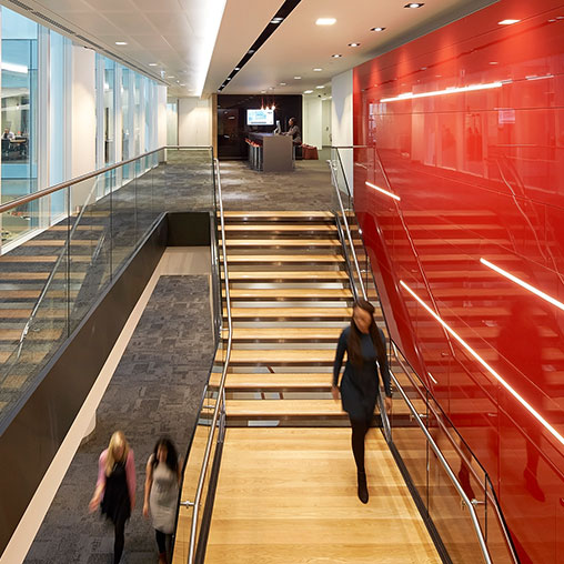 People walking down a flight of stairs.