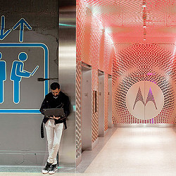 A person standing in a hallway.