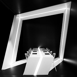 A white box with a gold ring.