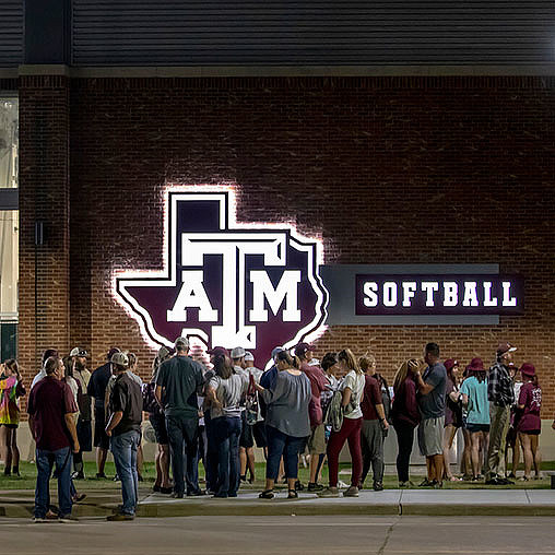 A group of people standing outside a building.