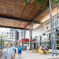 People walking under a covered area.