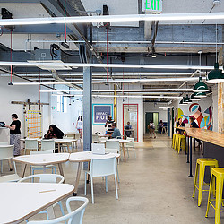 A room with tables and chairs.