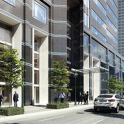 A building with a few people walking by it.