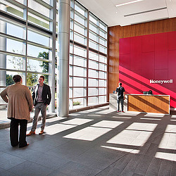 A group of people standing in a building.