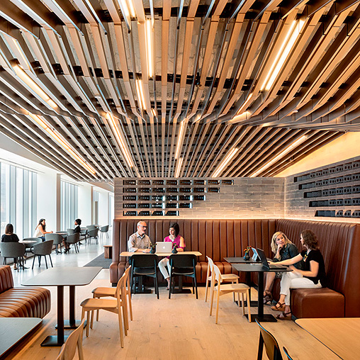 A group of people sitting at tables.