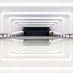 A white rectangular object with a black object on top.