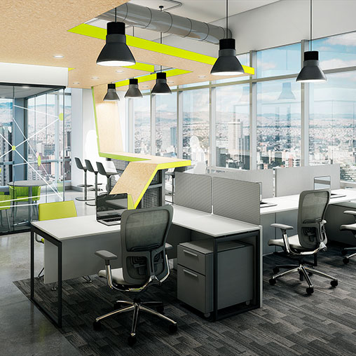 A room with a computer and chairs.