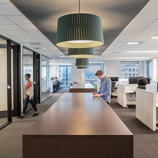 A man and a woman in an office.